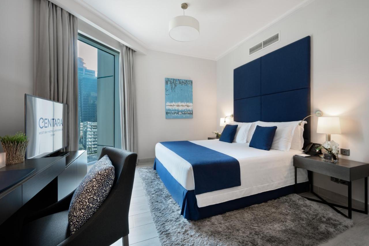 Centara West Bay Hotel & Residences Doha Exterior foto A bedroom at the Address Downtown Hotel